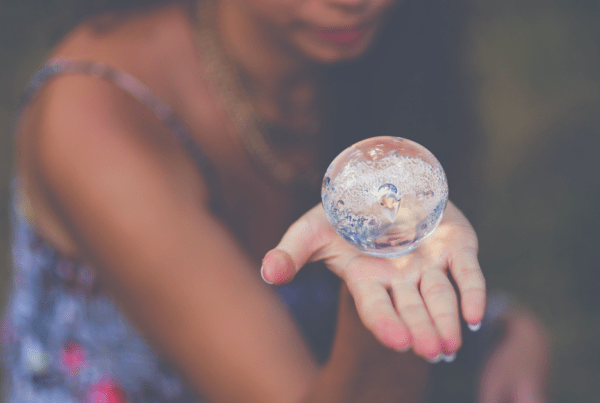 Woman holding crystal ball intuition psychic