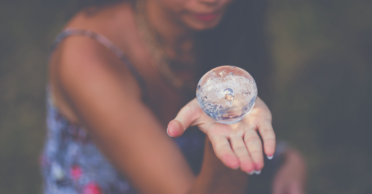 Woman holding crystal ball intuition psychic