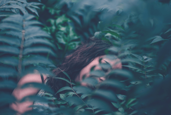 Lucid Dreaming woman sleeping in jungle leaves