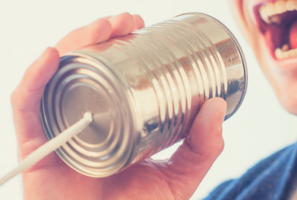 Man speaking into can communication