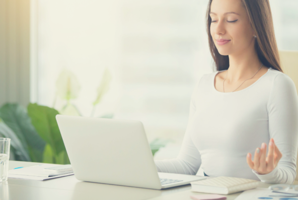 woman meditating in office