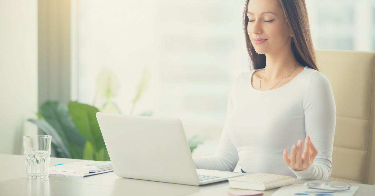 woman meditating in office